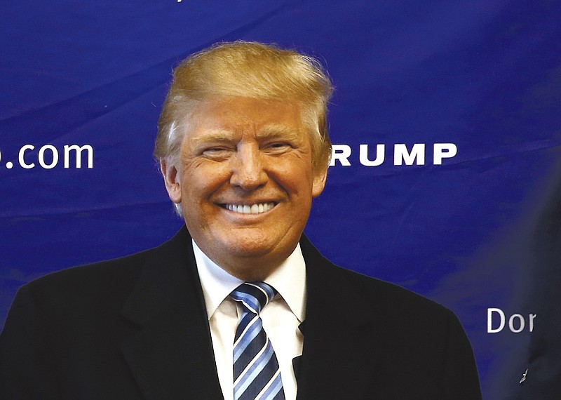 Republican presidential candidate Donald Trump visits his campaign office, Tuesday, Feb. 16, 2016, in Greenville, S.C.