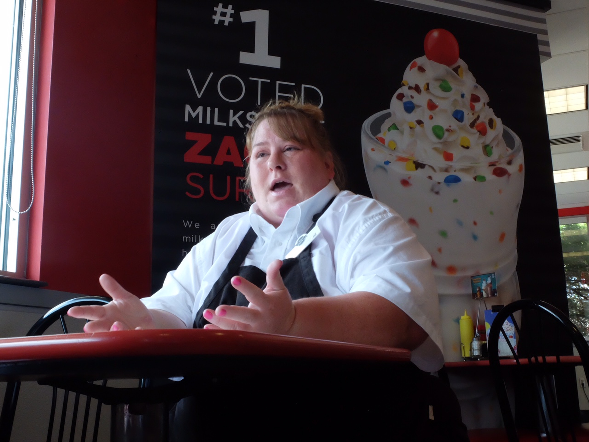 Lucinda Oboyle, 41, talks about the benefits of her new job inside the Steak "n Shake in Cleveland.