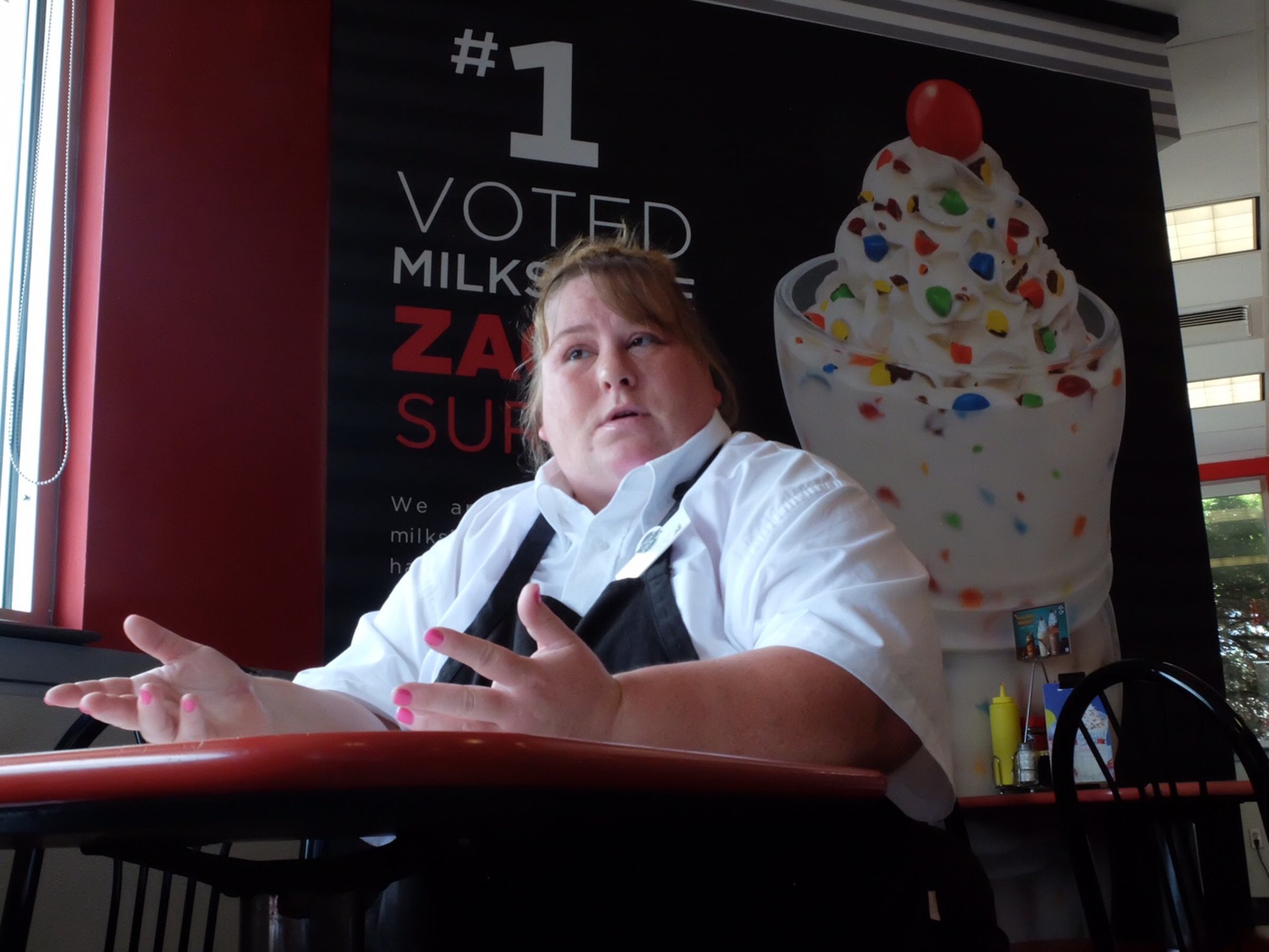 Lucinda Oboyle, 41, talks about the benefits of her new job inside the Steak "n Shake in Cleveland.