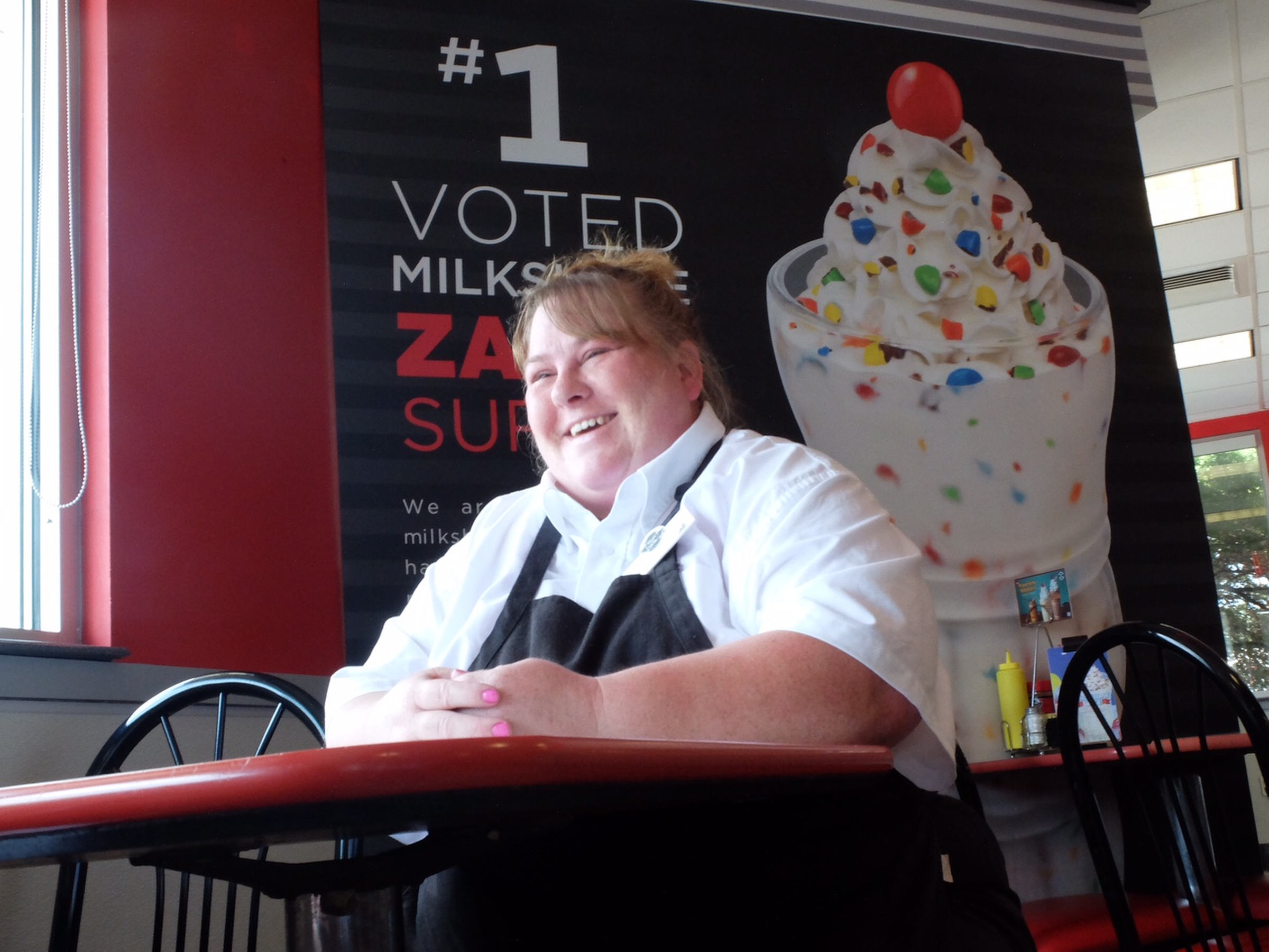 Lucinda Oboyle, 41, talks about the benefits of her new job inside the Steak "n Shake in Cleveland.