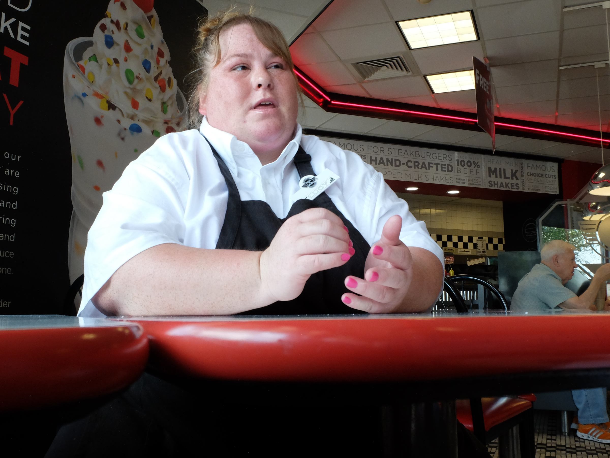 Lucinda Oboyle, 41, talks about the benefits of her new job inside the Steak "n Shake in Cleveland.