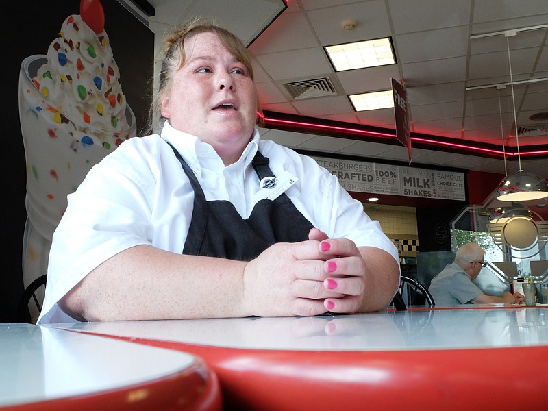 Lucinda Oboyle, 41, talks about the benefits of her new job inside the Steak "n Shake in Cleveland.