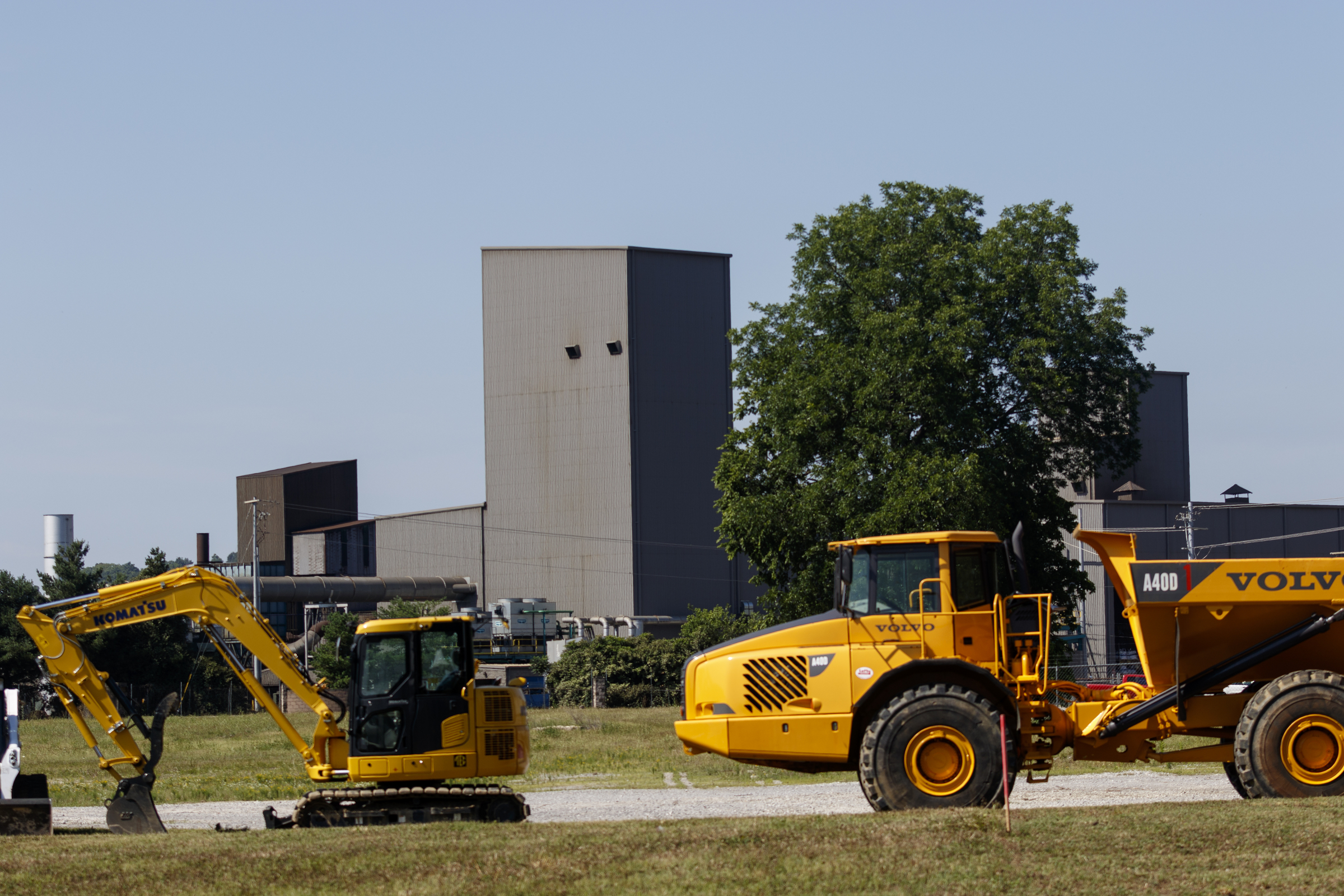 Construction equipment is parked at a field near the existing Lodge Manufacturing plant in preparation for a groundbreaking on Wednesday, June 29, 2016, in South Pittsburg, Tenn. The cast iron cookware manufacturer broke ground Wednesday on a new foundry.
