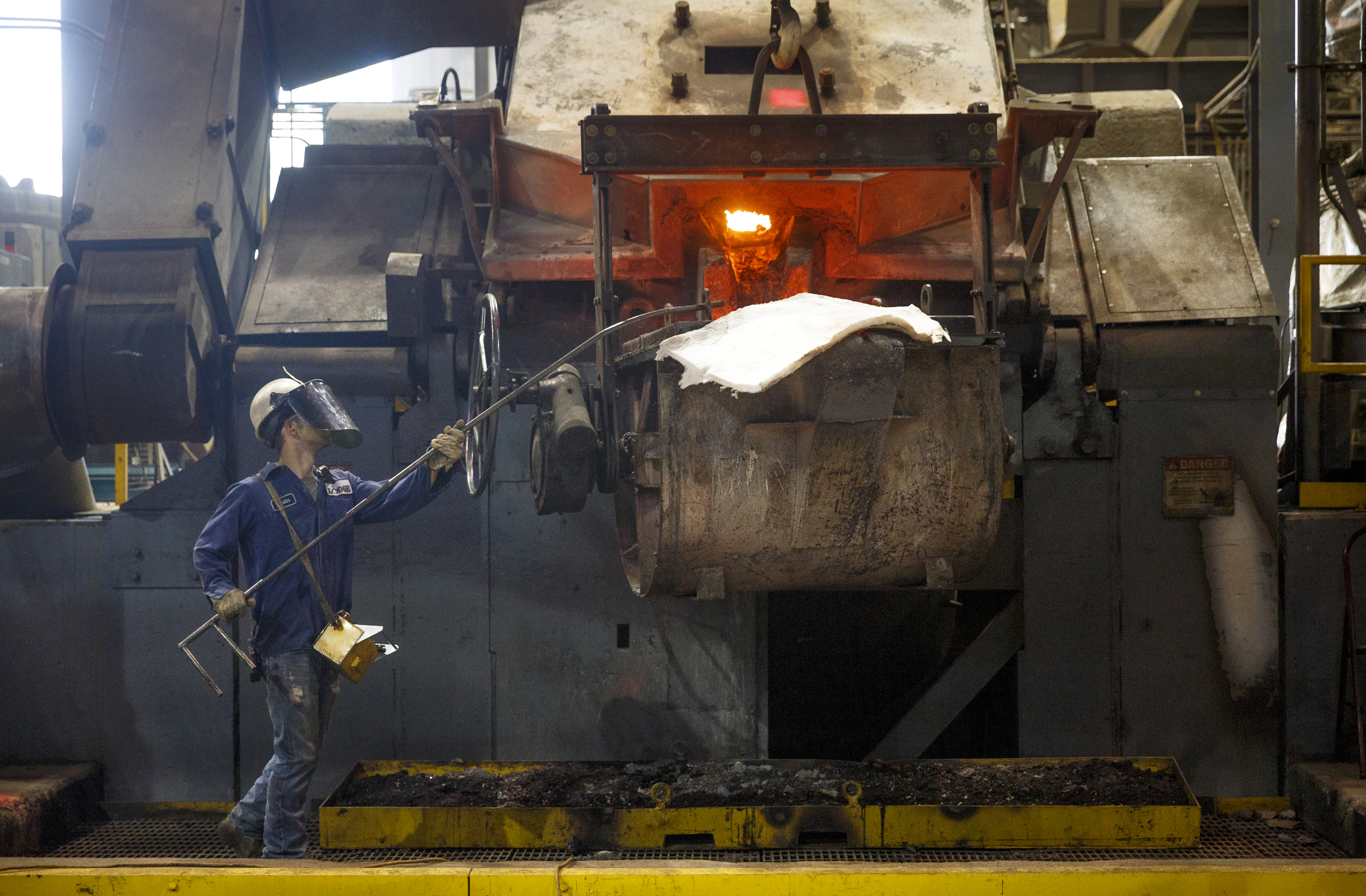 A foundry worker positions a bull in front of a furnace to be loaded with molten metal at Lodge Manufacturing on Wednesday, June 29, 2016, in South Pittsburg, Tenn. The cast iron cookware manufacturer broke ground Wednesday on a new foundry.