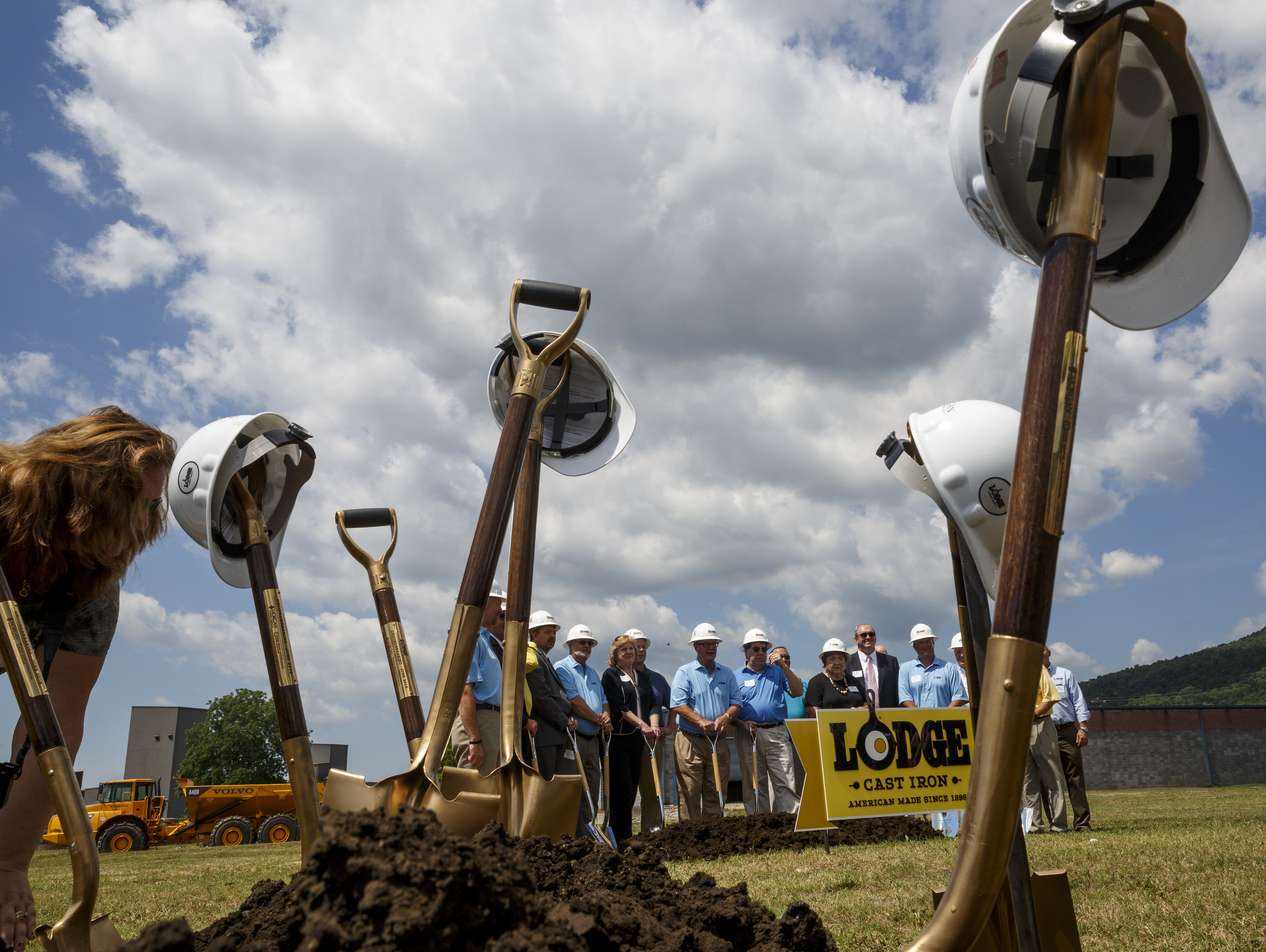 Shovels are stacked for a completed warehouse groundbreaking as Lodge Manufacturing executives pose for a second groundbreaking for a new foundry on Wednesday, June 29, 2016, in South Pittsburg, Tenn.