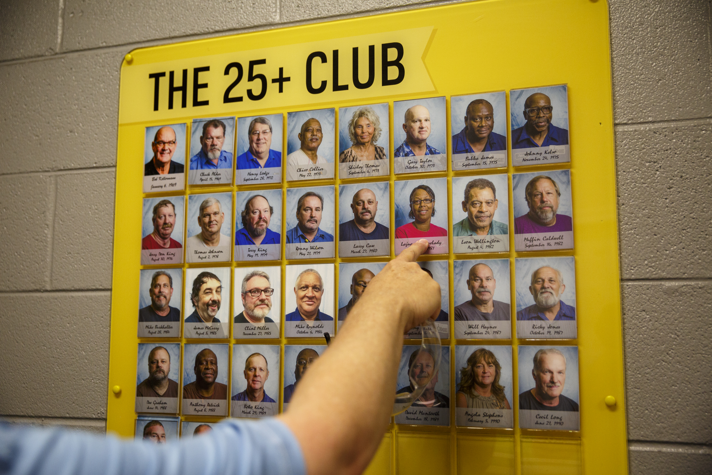 A sign lists employees of Lodge Manufacturing who have worked for the company for more than 25 years on Wednesday, June 29, 2016, in South Pittsburg, Tenn. The cast iron cookware manufacturer broke ground Wednesday on a new foundry.