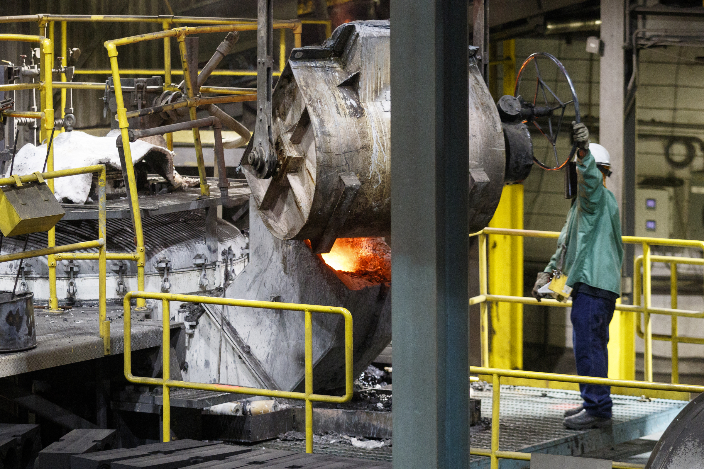 A worker pours molten metal from a bull into a molding machine where it is cast in sand molds at Lodge Manufacturing on Wednesday, June 29, 2016, in South Pittsburg, Tenn. The cast iron cookware manufacturer broke ground Wednesday on a new foundry.