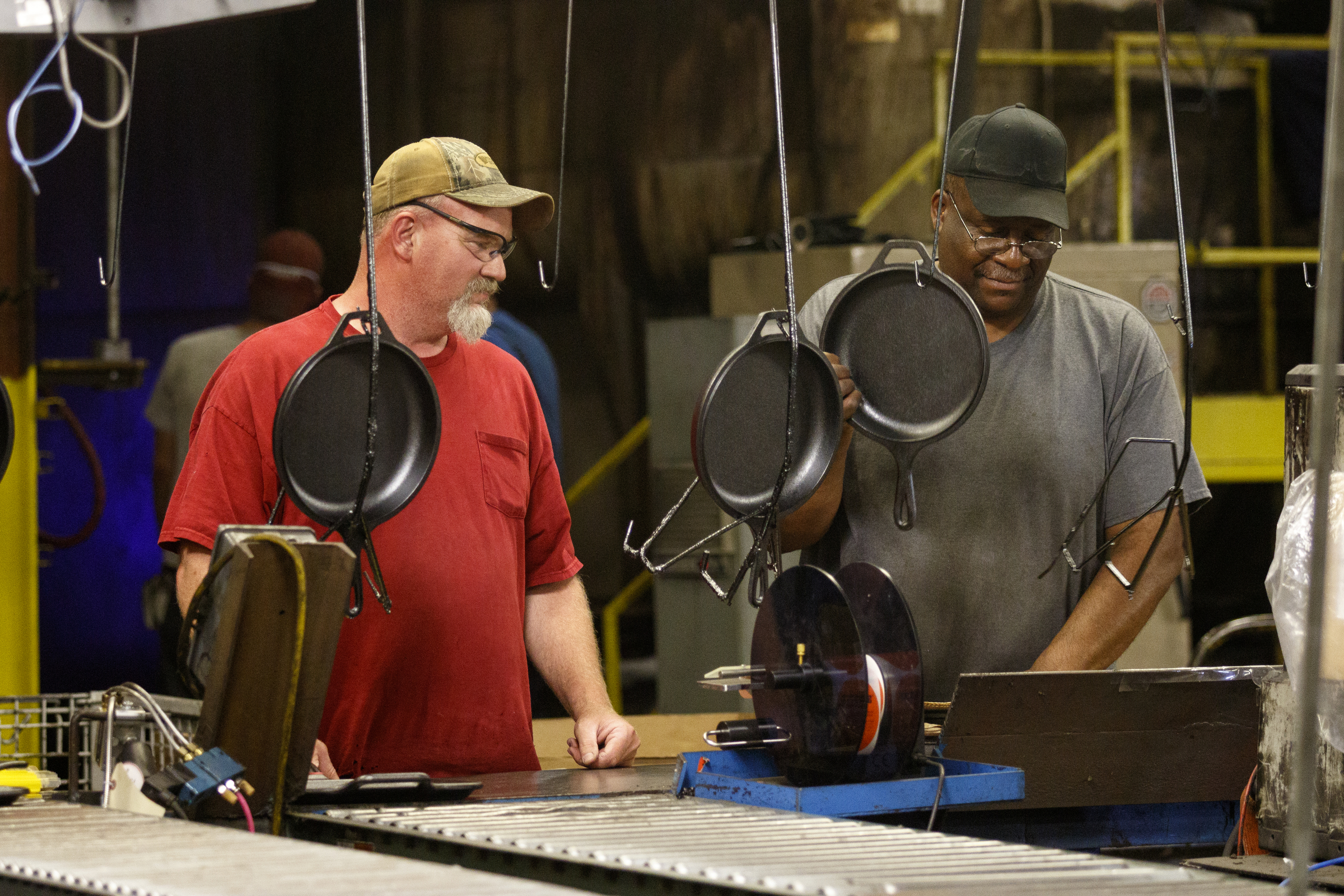 Workers box cast iron cookware to be distributed at Lodge Manufacturing on Wednesday, June 29, 2016, in South Pittsburg, Tenn. The cast iron cookware manufacturer broke ground Wednesday on a new foundry.