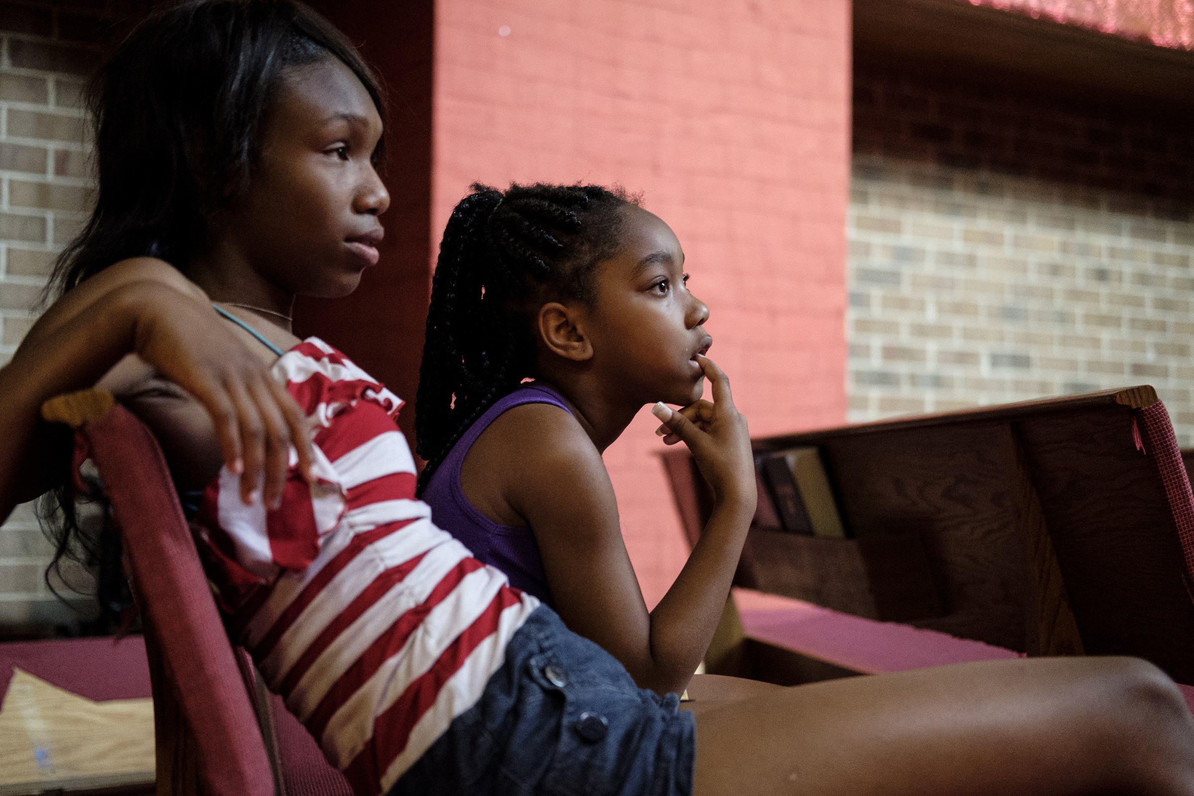 Eyonnah Norman, left, and Shanta'vya Dean listen to a video lesson at a camp for kids operated by Gloria Griffith at Renaissance Presbyterian Church on Tuesday, June 28, 2016, in Chattanooga, Tenn. Griffith has operated the camp for 5 years, but because of health problems, Griffith expects that she will have to end the camp this month if she can't find someone to take her place.