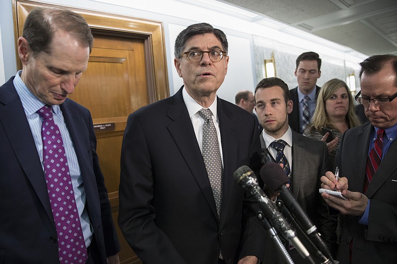 
              Treasury Secretary Jacob Lew, joined by Sen. Ron Wyden, D-Ore., ranking member of the Senate Finance Committee, left, speaks to reporters on Capitol Hill in Washington, Tuesday, June 28, 2016, warning of widespread consequences if the Senate fails to act before Friday on a rescue package for debt-stricken Puerto Rico. The U.S. territory is in a decade-long recession and owes a $2 billion debt payment to creditors on July 1. (AP Photo/J. Scott Applewhite)
            