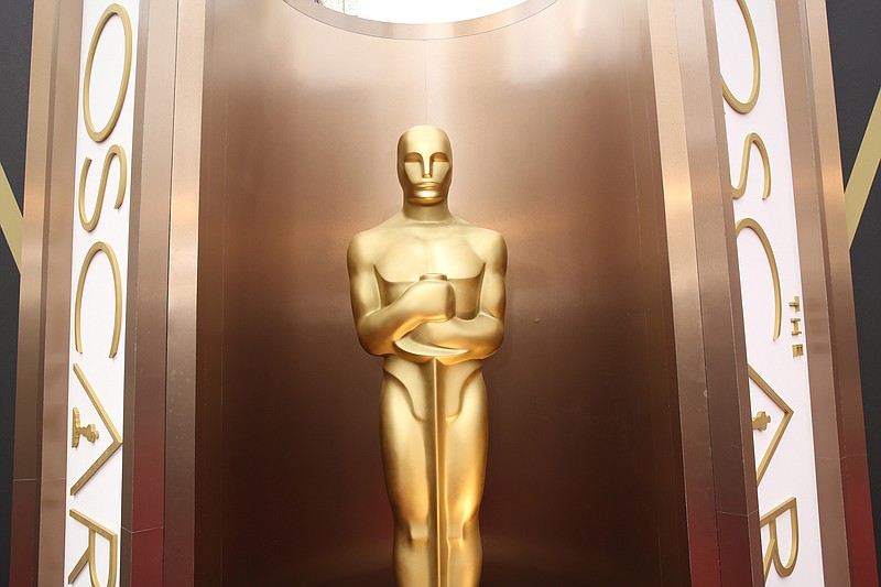 
              FILE - In this March 2, 2014 file photo, an Oscar statue is displayed at the Oscars at the Dolby Theatre in Los Angeles.  Six months after announcing intentions to double the number of female and minority members in its ranks, the Academy of Motion Picture Arts and Sciences has invited 683 new members to join the organization. The academy says its invitees are 46 percent female, 41 percent minority and represent 59 countries.(Photo by Matt Sayles/Invision/AP, File)
            