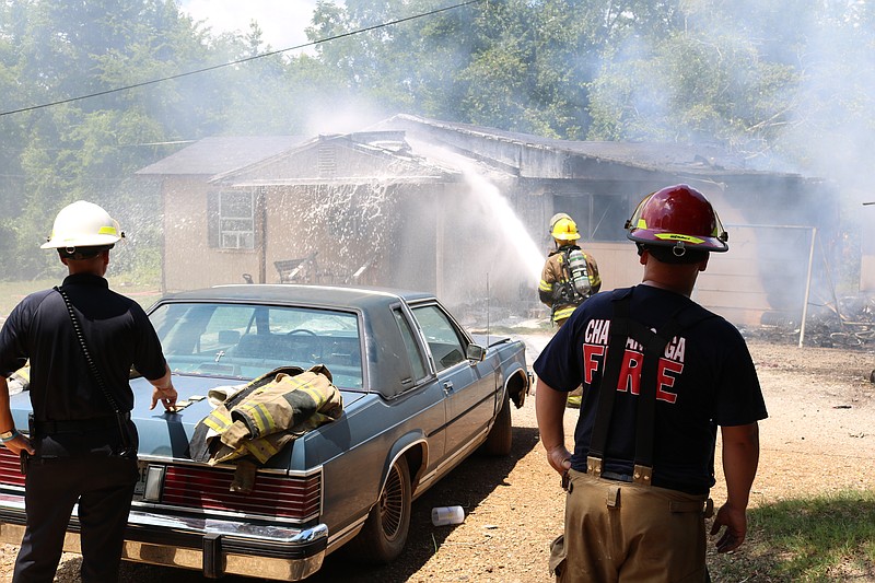 Chattanooga firefighters work to extinguish a house fire Wednesday, July 29, at 8143 East Brainerd Road.
