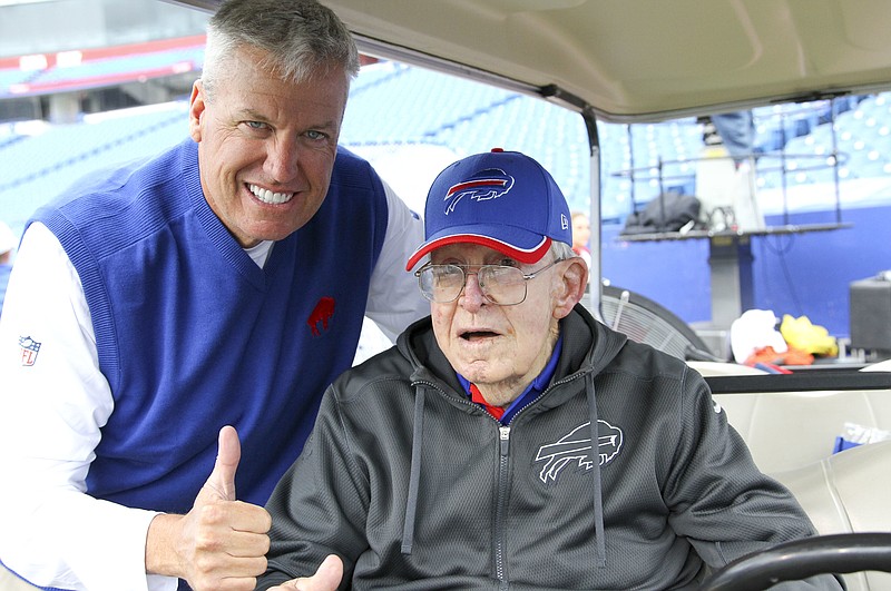 In this Sept. 13, 2015, file photo, Buffalo Bills head coach Rex Ryan, left, visits with his father Buddy Ryan before an NFL football game against the Indianapolis Colts in Orchard Park, N.Y. Buddy Ryan, who coached two defenses that won Super Bowl titles and whose twin sons Rex and Rob have been successful NFL coaches, died Tuesday, June 28, 2016. He was 82.