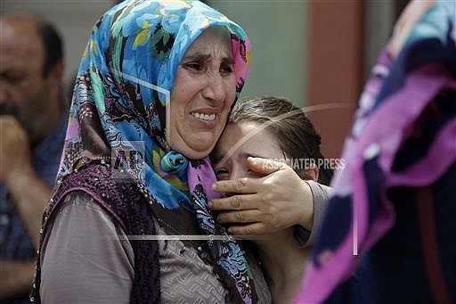 Family members of victims cry outside the Forensic Medical Center in Istanbul, Wednesday, June 29, 2016. Suicide attackers killed dozens and wounded more than 140 at Istanbul's busy Ataturk Airport late Tuesday, the latest in a series of bombings to strike Turkey in recent months. Turkish officials said the massacre was most likely the work of the Islamic State group.(AP Photo/Emrah Gurel) 