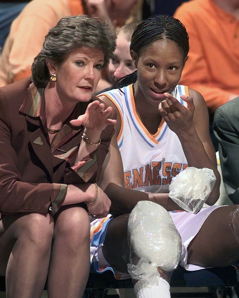 In this Feb. 26, 1999, file photo, Tennessee head coach Pat Summitt talks with Chamique Holdsclaw on the bench as Holdsclaw ices her knees in the final minutes of their game against Florida at the SEC women's tournament in Chattanooga, Tenn. Summitt, the winningest coach in Division I college basketball history who uplifted the women's game from obscurity to national prominence during her career at Tennessee, died Tuesday morning, June 28, 2016. She was 64.