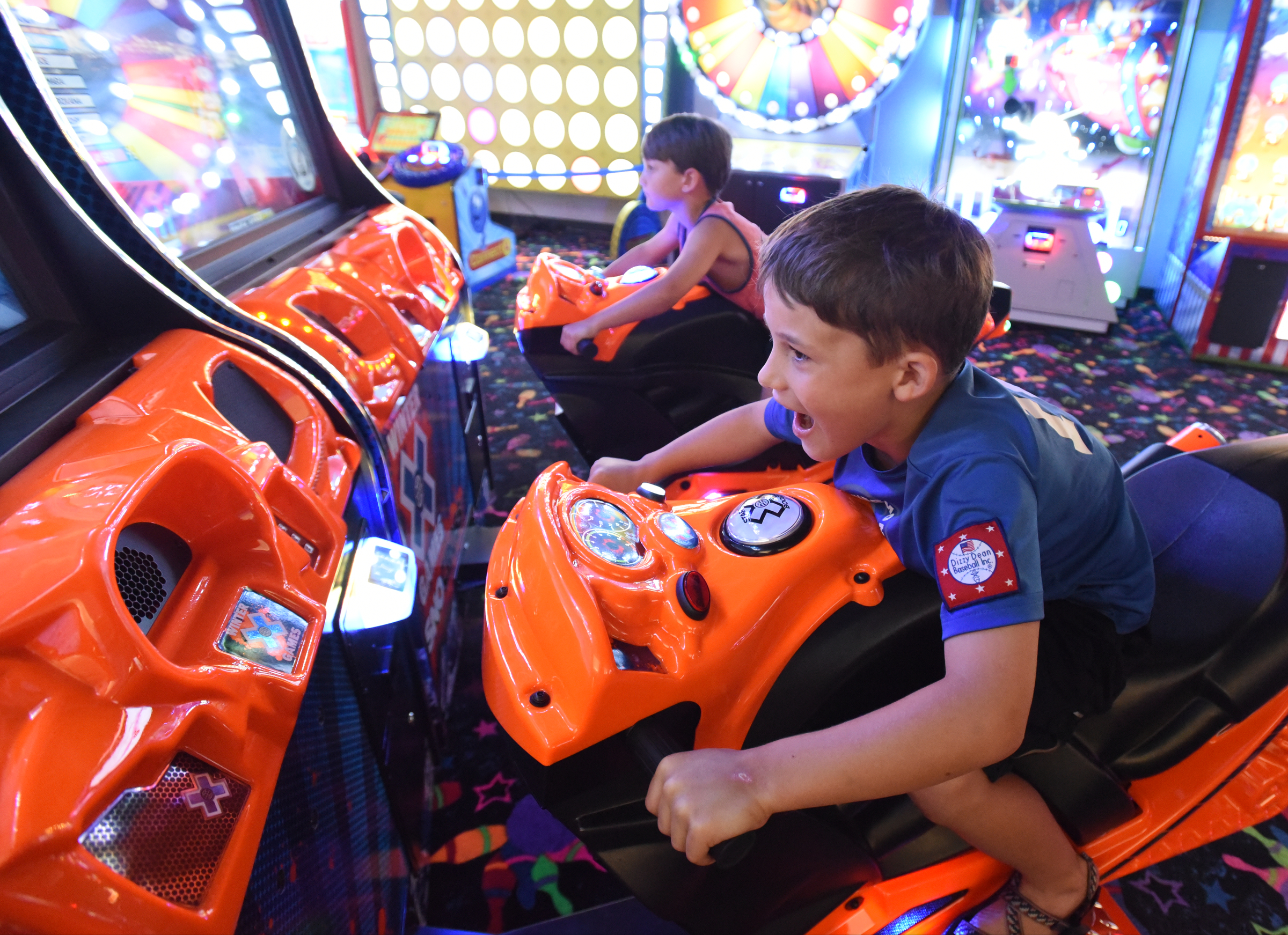 Wills, right, and Charlie Johnson play a game Tuesday, June 28, 2016 at Pin Strikes Bowling.