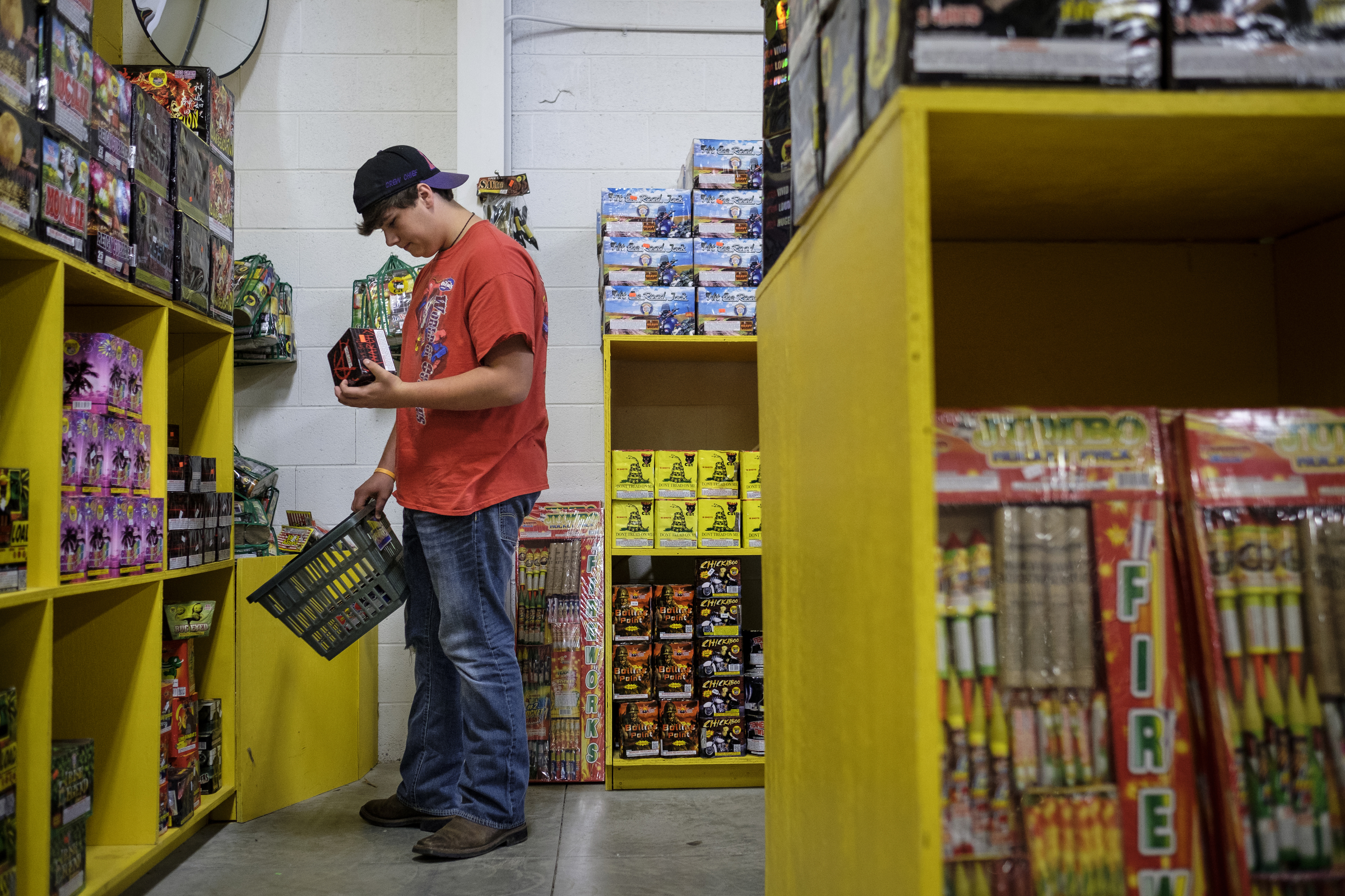 Samuel Easley shops for fireworks in preparation for the 4th of July at Dixieland Fireworks on Wednesday, June 29, 2016, in East Ridge, Tenn. The days preceding the holiday are the store's busiest.
