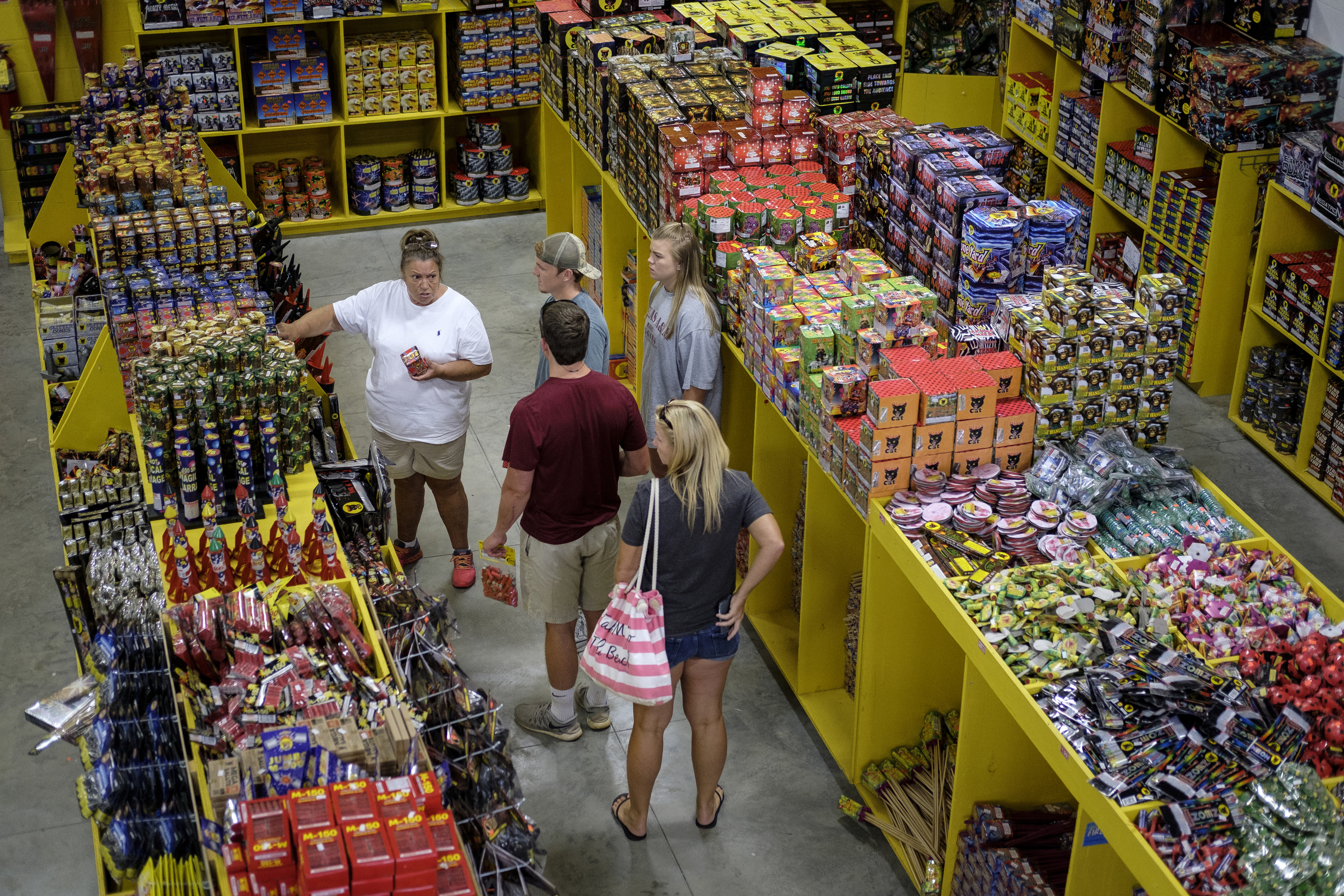 Customers shop for fireworks in preparation for the 4th of July at Dixieland Fireworks on Wednesday, June 29, 2016, in East Ridge, Tenn. The days preceding the holiday are the store's busiest.
