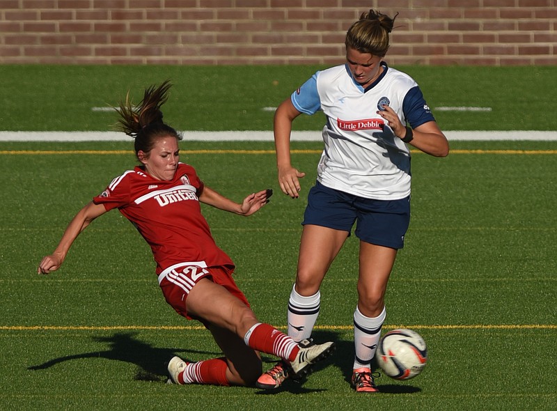 Chattanooga Football Club Atlanta's Jocelyn Baker goes down as she and Chattanooga Football Club's Mara Deluca battle for control Thursday, June 30, 2016 at Finley Stadium.