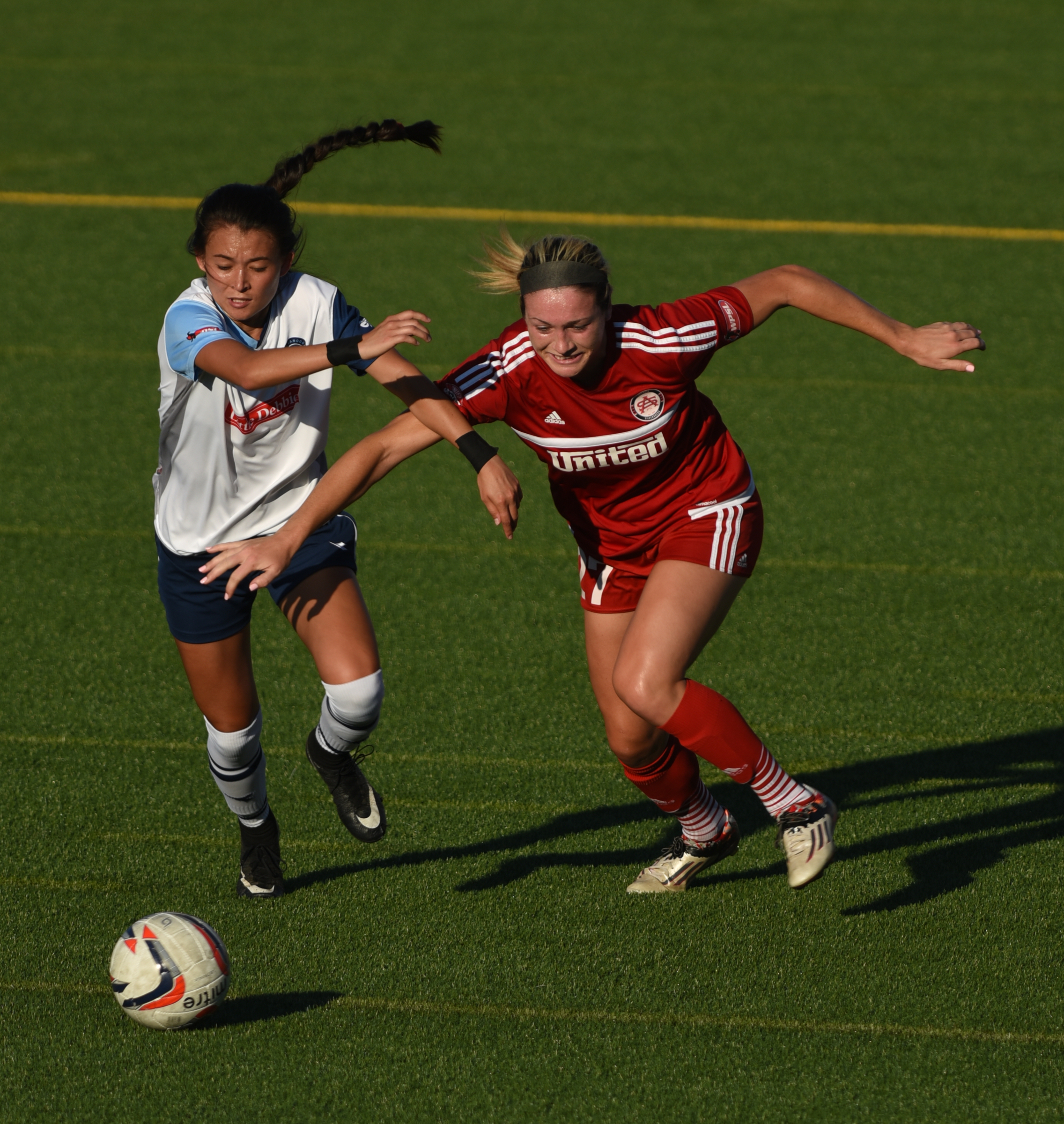 Chattanooga Football Club's McKenna Davidson and Atlanta's Brittney Reed pursue the ball Thursday, June 30, 2016 at Finley Stadium.