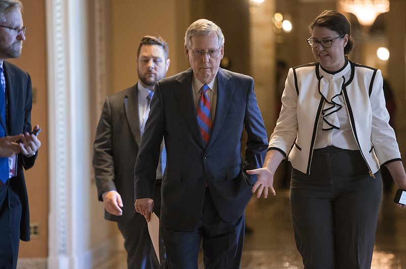 
              Senate Majority Leader Mitch McConnell of Ky. walks to the Senate chamber on Capitol Hill in Washington, Wednesday, June 29, 2016, as the Senate works on a rescue package for debt-stricken Puerto Rico, just two days before the island is expected to default on a $2 billion debt payment. The bill, passed by the House earlier this month, would create a control board that would oversee the island's finances and could supervise some debt restructuring. (AP Photo/J. Scott Applewhite)
            