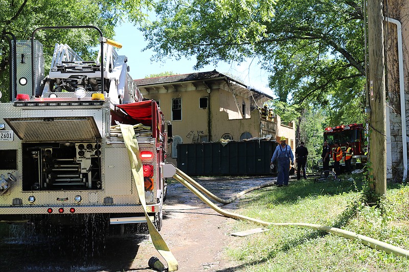 Chattanooga firefighters work to extinguish a blaze at a home at 125 Shawnee Trail in Brainerd today.