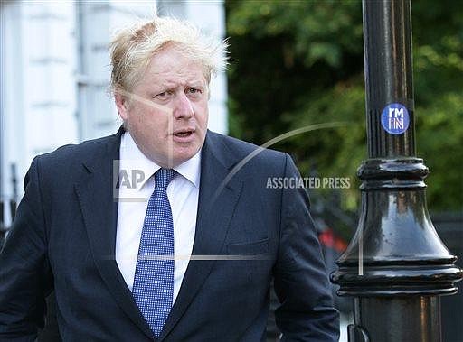 Former London Mayor and prominent " Vote Leave" campaigner Boris Johnson leaves his home in north London, Tuesday June 28, 2016. Johnson is expected to be one of the main contenders in the race to become the next ruling Conservative Party leader. (Yui Mok/PA via AP) 