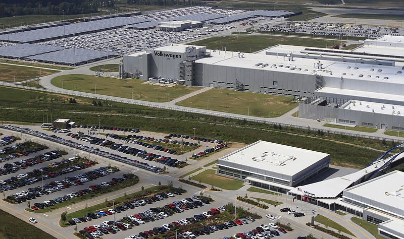 Staff Photo by Dan Henry/Chattanooga Times Free Press - 9/20/12.  New Volkswagen Passats are seen behind the Chattanooga assembly plant's building front.