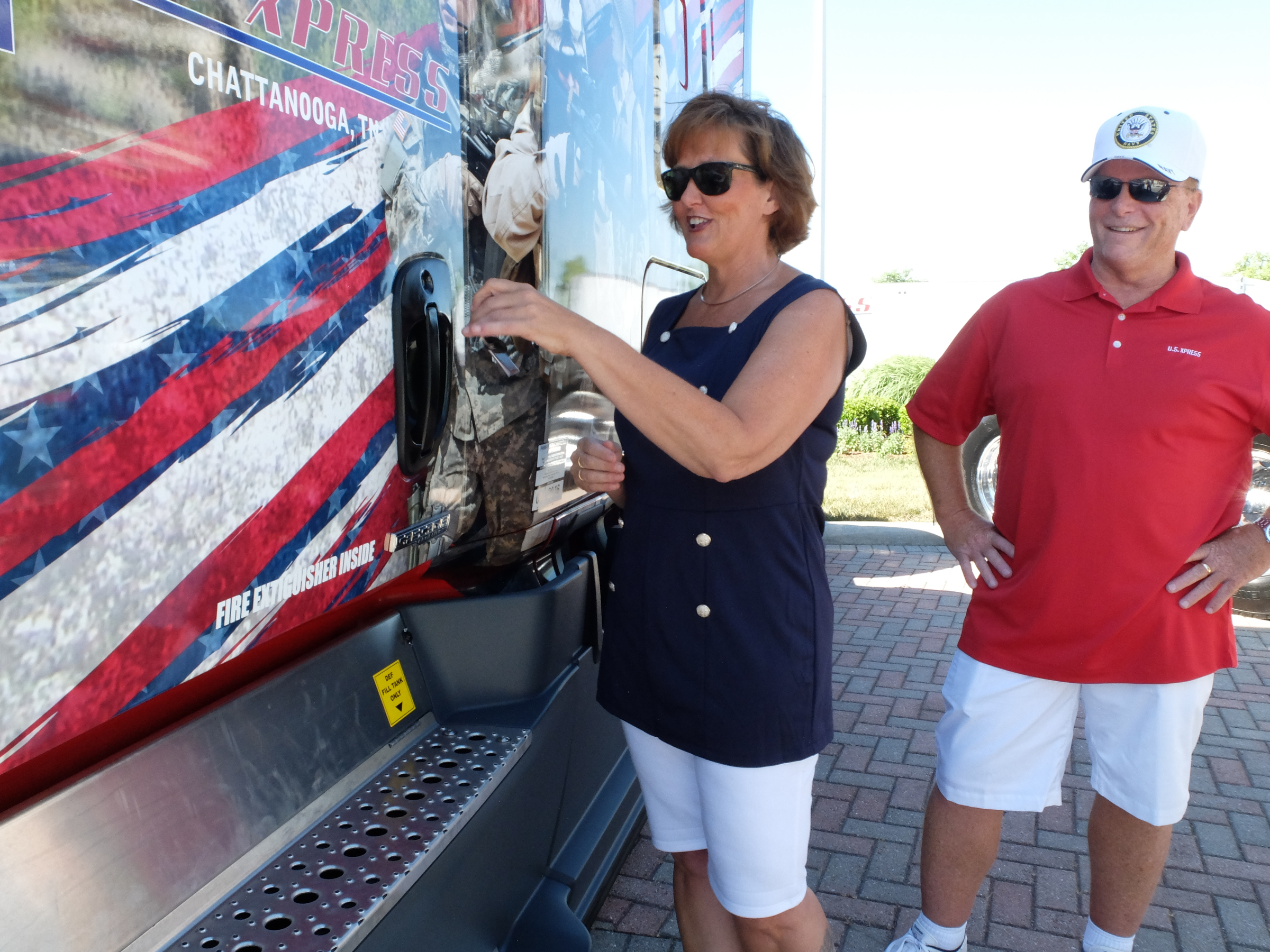 Weazy Sullivan, 54, opens the door of a new U.S. Xpress military themed Freightliner truck Friday at the company's Jenkins Road headquarters in Chattanooga. She and her husband, Tom Sullivan, right, plan to drive for about 15-more-years, according to the Sullivans.
U.S. Xpress aims to hire more military veterans over coming years.