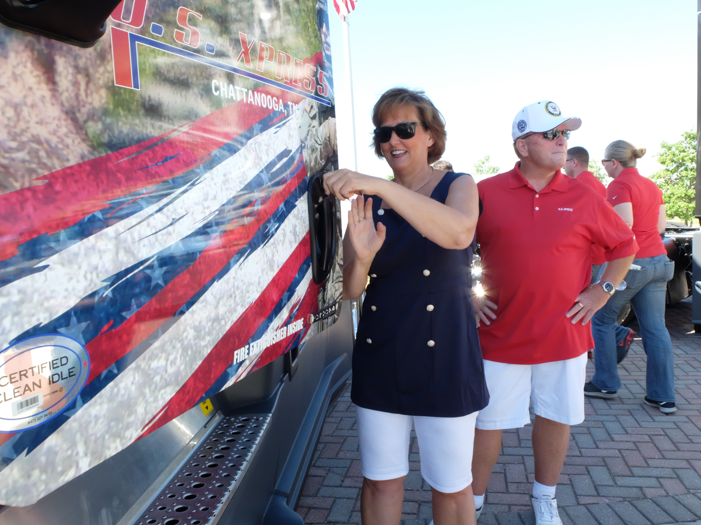 Weazy Sullivan, 54, opens the door of a new U.S. Xpress military themed Freightliner truck Friday at the company's Jenkins Road headquarters in Chattanooga. She and her husband, Tom Sullivan, right, plan to drive for about 15-more-years, according to the Sullivans.
U.S. Xpress aims to hire more military veterans over coming years.