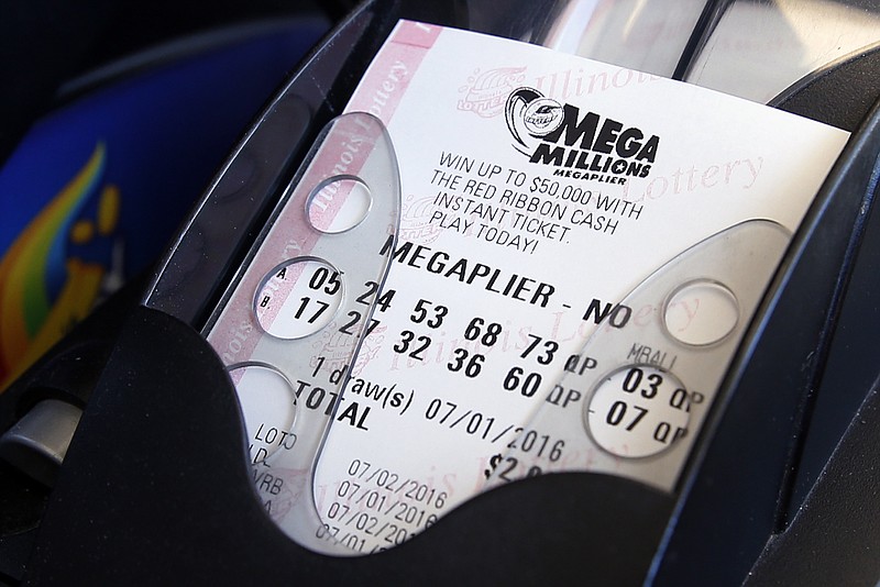 
              A Mega Millions lottery ticket is printed out of a lottery machine at a convenience store in Chicago, Friday, July 1, 2016. Friday night's Mega Millions drawing will give lottery players a shot at the 10th largest jackpot in U.S. history. (AP Photo/Nam Y. Huh)
            