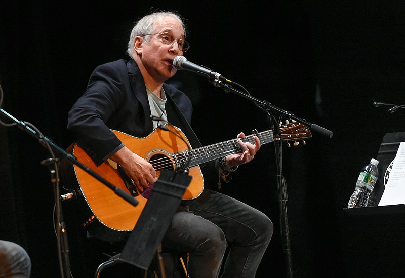 
              FILE - In this Oct. 6, 2015 file photo, Paul Simon participates in the Country Music Hall of Fame benefit concert in New York. Simon is ending his North American tour with two gigs in his native New York. During the first Thursday, June 30, 2016, at Forest Hills Stadium, he made no reference to an interview he gave earlier in the week where he talked about retiring. (Photo by Evan Agostini/Invision/AP, File)
            