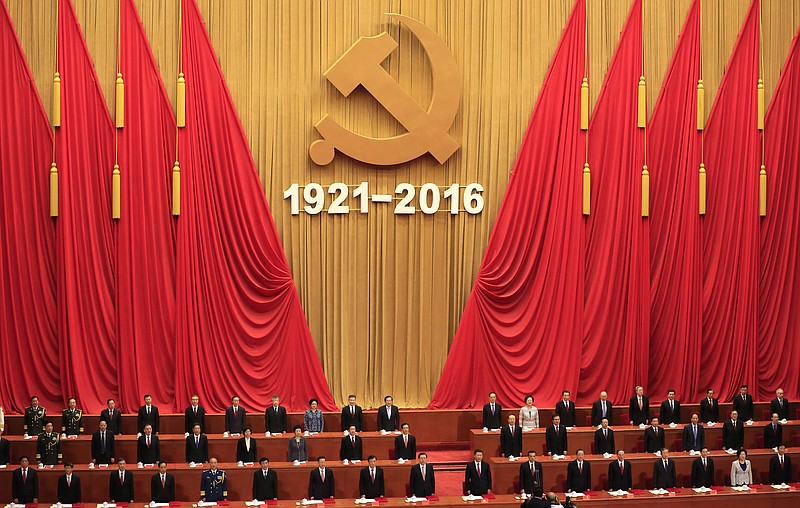 
              Chinese President Xi Jinping, 10th from left in first row, delivers his speech during a celebration ceremony to mark the 95th anniversary of the founding of the Communist Party of China at the Great Hall of the People in Beijing, Friday, July 1, 2016. (How Hwee Young/Pool Photo via AP)
            