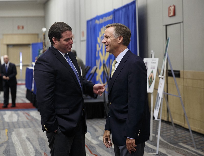 Tennessee Gov. Bill Haslam, right, talks with Nick Wilkinson after speaking at at Rotary luncheon at the Chattanooga Convention Center on Thursday, June 16, 2016, in Chattanooga, Tenn. Gov. Haslam, who recently met with Republican presidential candidate Donald Trump along with several other governors, said he has no interest in being Vice President but suggested Sen. Bob Corker as a possible candidate.