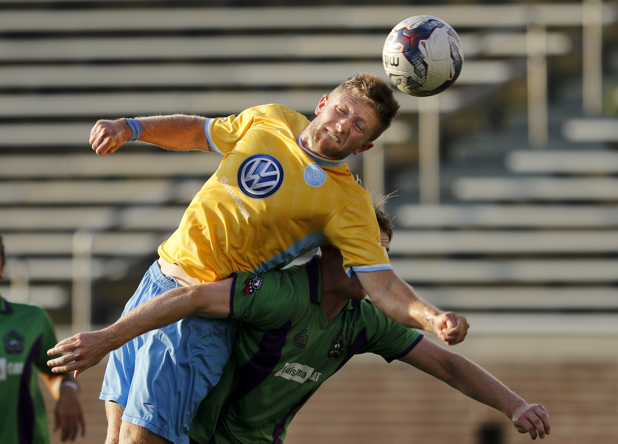 CFC's Luke Winter heads the ball on the goal over New Orleans player Nathan Heath during CFC's soccer match against the New Orleans Jesters at Finley Stadium on Saturday, July 2, 2016, in Chattanooga, Tenn.