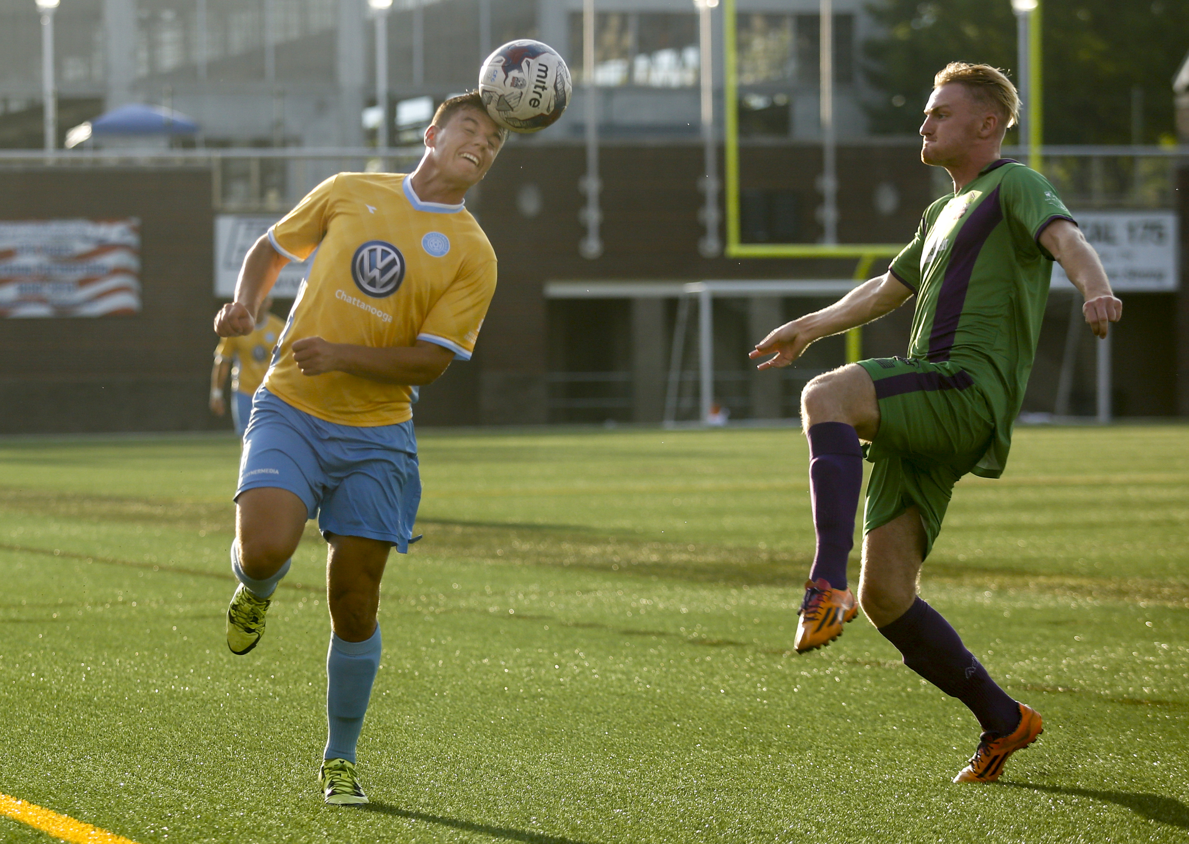 CFC's William Roberts heads the ball towards New Orleans player Niall Smith to keep it inbounds during CFC's soccer match against the New Orleans Jesters at Finley Stadium on Saturday, July 2, 2016, in Chattanooga, Tenn.