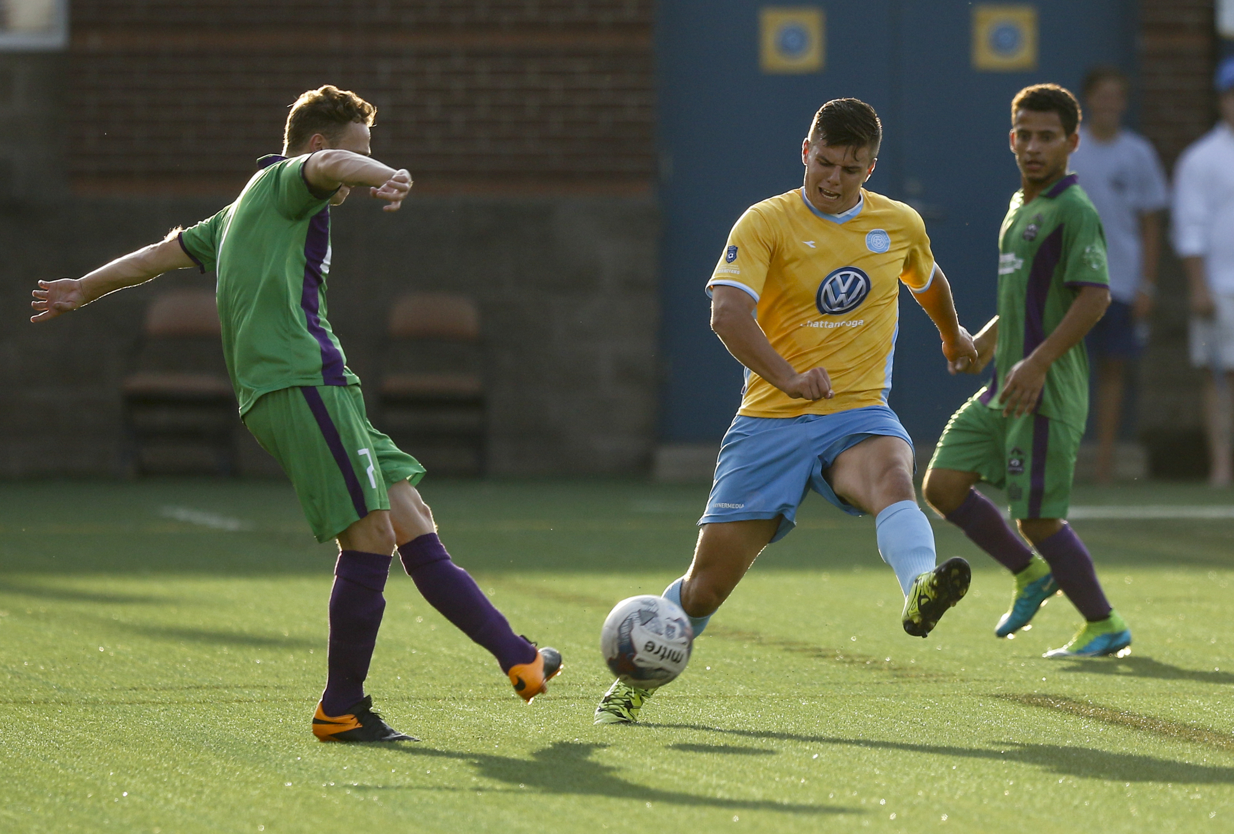 CFC's John Carrier, center, blocks a shot by New Orleans player Niall Smith during CFC's soccer match against the New Orleans Jesters at Finley Stadium on Saturday, July 2, 2016, in Chattanooga, Tenn.