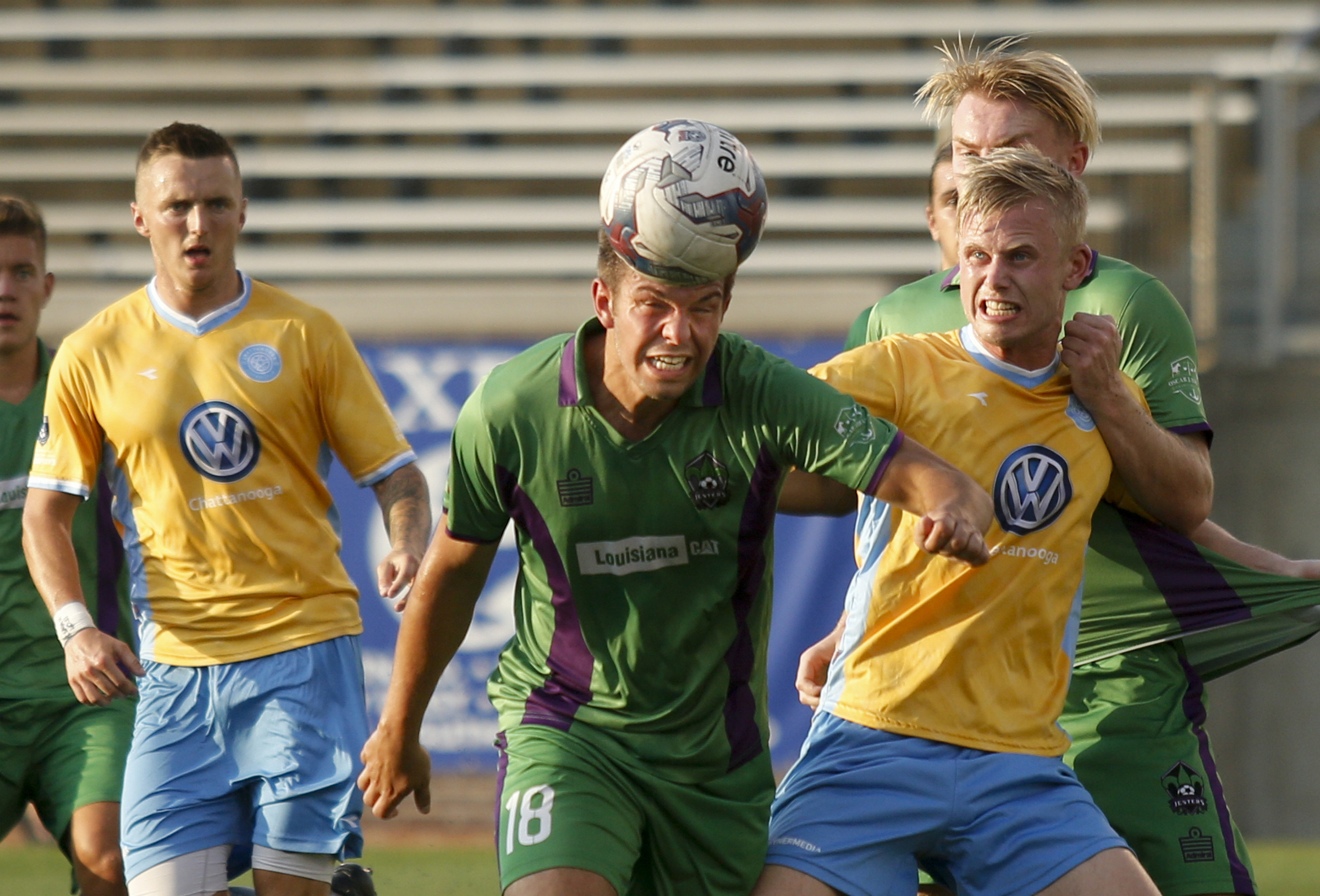 New Orleans player Ralph Price clears the ball with a header away from the goal and CFC's Sindre Welo, right, during CFC's soccer match against the New Orleans Jesters at Finley Stadium on Saturday, July 2, 2016, in Chattanooga, Tenn.