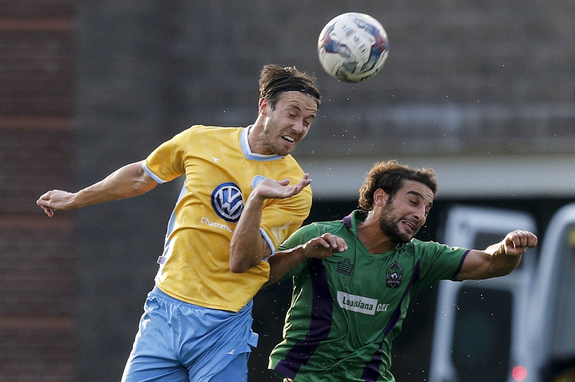 CFC's Matthew Aldred, left, heads the ball against New Orleans player Tony Judice during CFC's soccer match against the New Orleans Jesters at Finley Stadium on Saturday, July 2, 2016, in Chattanooga, Tenn.