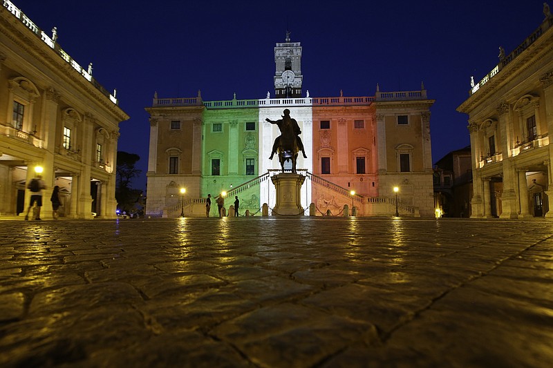 
              The facade of Rome's Campidoglio Capitol Hill is lit with the colors of the Italian flag, in Rome, Saturday, July 2, 2016. Italy's foreign minister said the bodies of nine Italians have been identified after a group of armed extremists stormed a restaurant in Bangladesh. (AP Photo/Andrew Medichini)
            