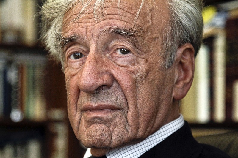 In this Sept. 12, 2012, photo Elie Wiesel is photographed in his office in New York. Israel's Yad Vashem Holocaust Memorial says Elie Wiesel has died at 87. (AP Photo/Bebeto Matthews)