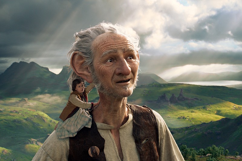 This image released by Disney shows Ruby Barnhill and the Big Friendly Giant from Giant Country, voiced by Mark Rylance, in a scene from"The BFG." "The Legend of Tarzan" and "The BFG" were both dwarfed by "Finding Dory" over the July 4th weekend, as the Pixar sequel led the box office for the third straight weekend. (Disney via AP, File)