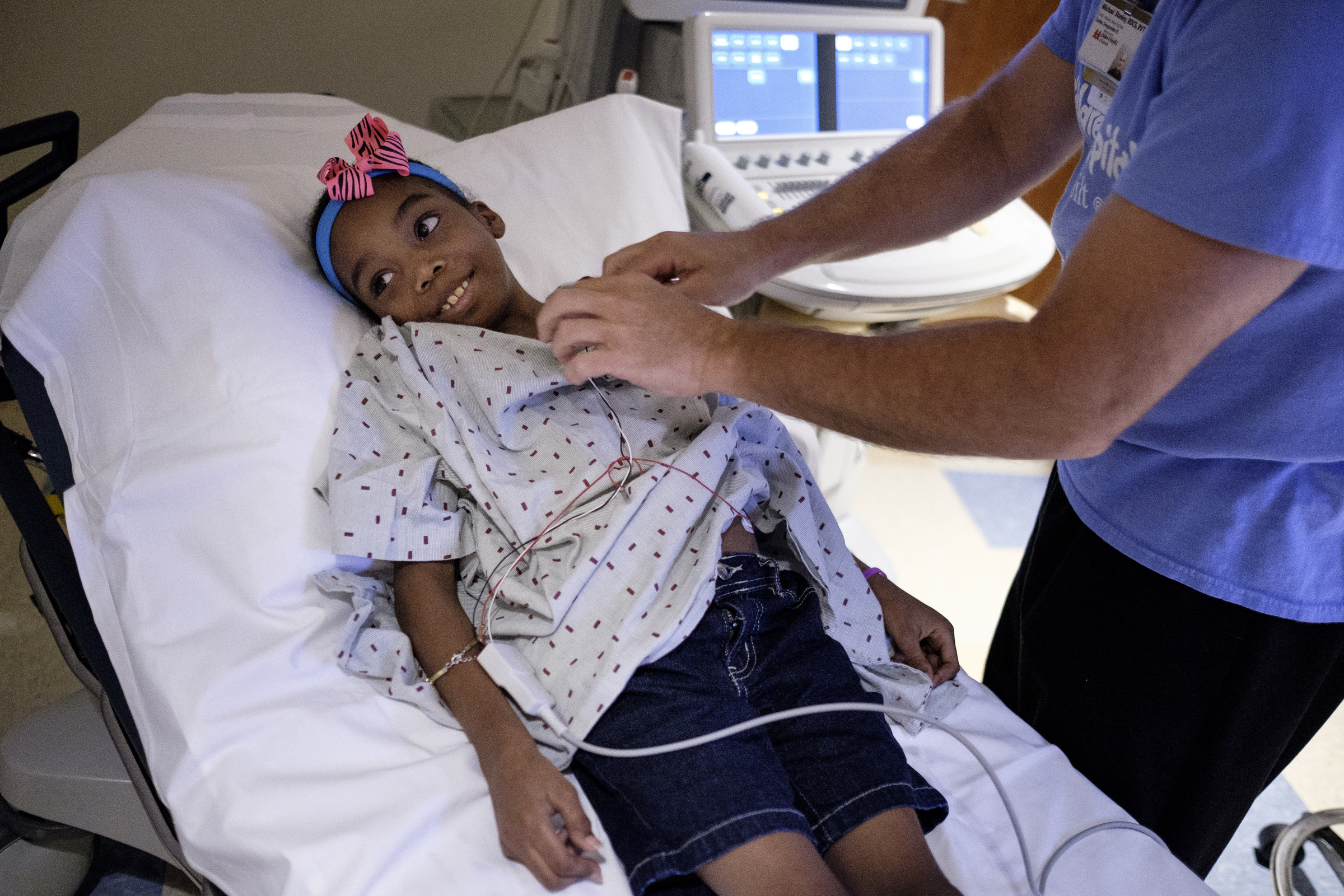 Echocardiographer Michael Stanley performs an echocardiogram to check the functionality of Ahmya Calloway's new heart almost 2 months after her transplant at Vanderbilt Children's Hospital on Thursday, June 30, 2016, in Nashville, Tenn. Ahmya received both a heart and kidney transplant after living most of her life with kidney disease.