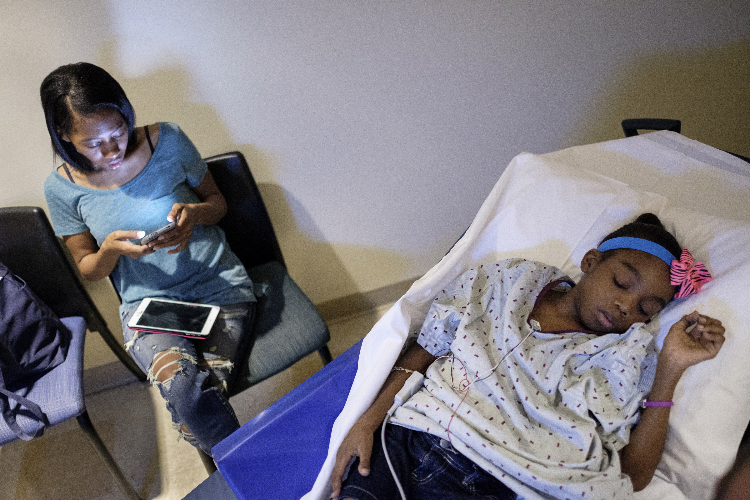 Darnima Calloway sits nearby as her daughter Ahmya receives an echocardiogram to check the functionality of her new heart after two months after her transplant at Vanderbilt Children's Hospital on Thursday, June 30, 2016, in Nashville, Tenn. Ahmya received both a heart and kidney transplant after living most of her life with kidney disease.