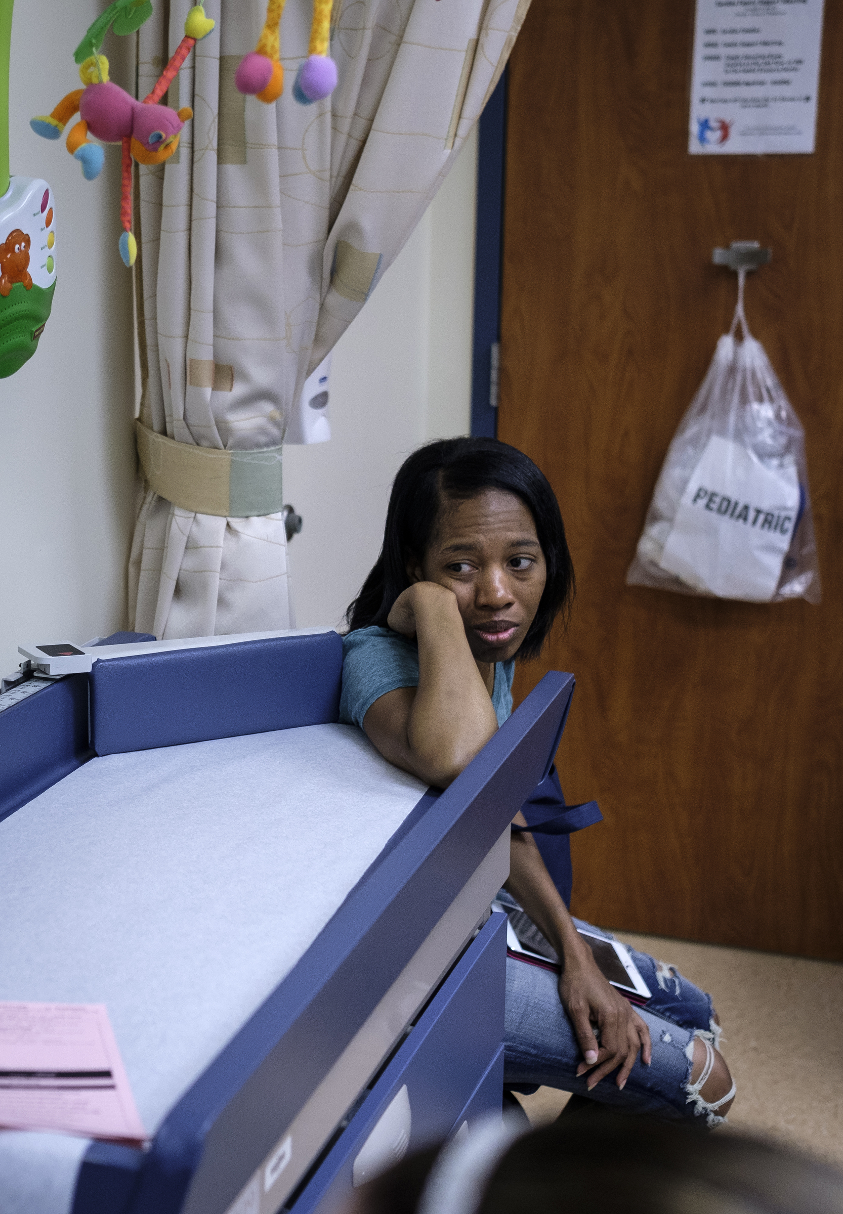 Darnima Calloway, Ahmya's mother, watches as her daughter goes through one of her regular checkups to monitor her new heart at Vanderbilt Children's Hospital on Thursday, June 30, 2016, in Nashville, Tenn. Darnima had been staying in Nashville so that she could take Ahmya to checkups 3 times a week.