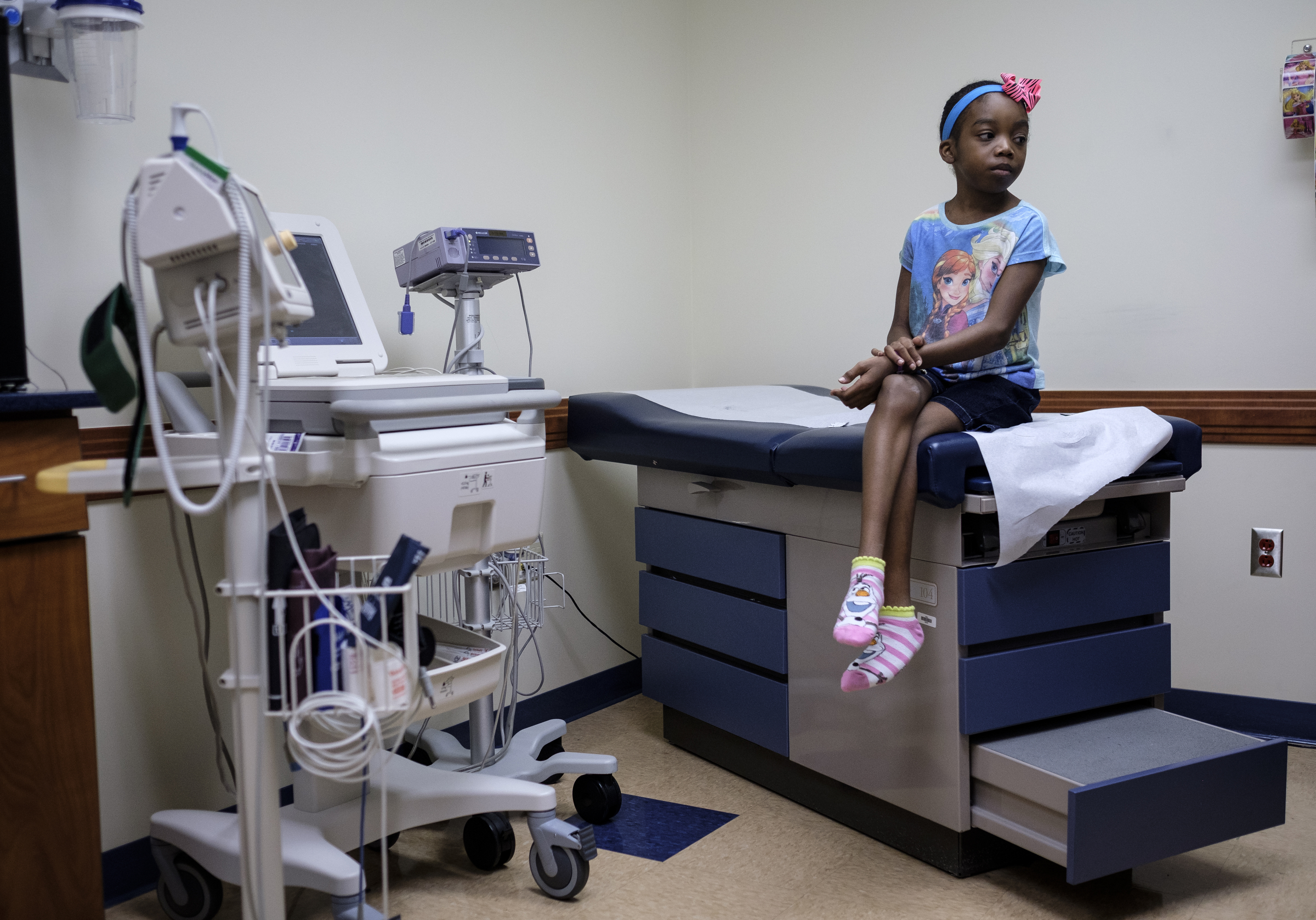 Ahmya Calloway sits on a medical table as she waits to undergo one of her regular checkups to monitor her new heart at Vanderbilt Children's Hospital on Thursday, June 30, 2016, in Nashville, Tenn. Almost two months after receiving a heart and kidney transplant, Ahmya was told she could transition to once-weekly checkups and return home to Chattanooga.