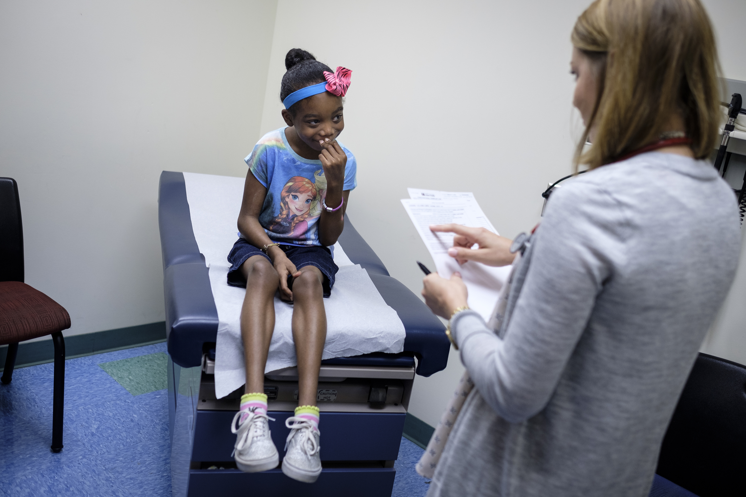 Nurse practitioner Kari Wujcik asks Ahmya Calloway to list off all of her medications during one of Ahmya's regular checkups to monitor her new heart at Vanderbilt Children's Hospital on Thursday, June 30, 2016, in Nashville, Tenn. Ahmya will spend the rest of her life on anti-rejection drugs so that her body does not reject her transplanted heart and kidney.