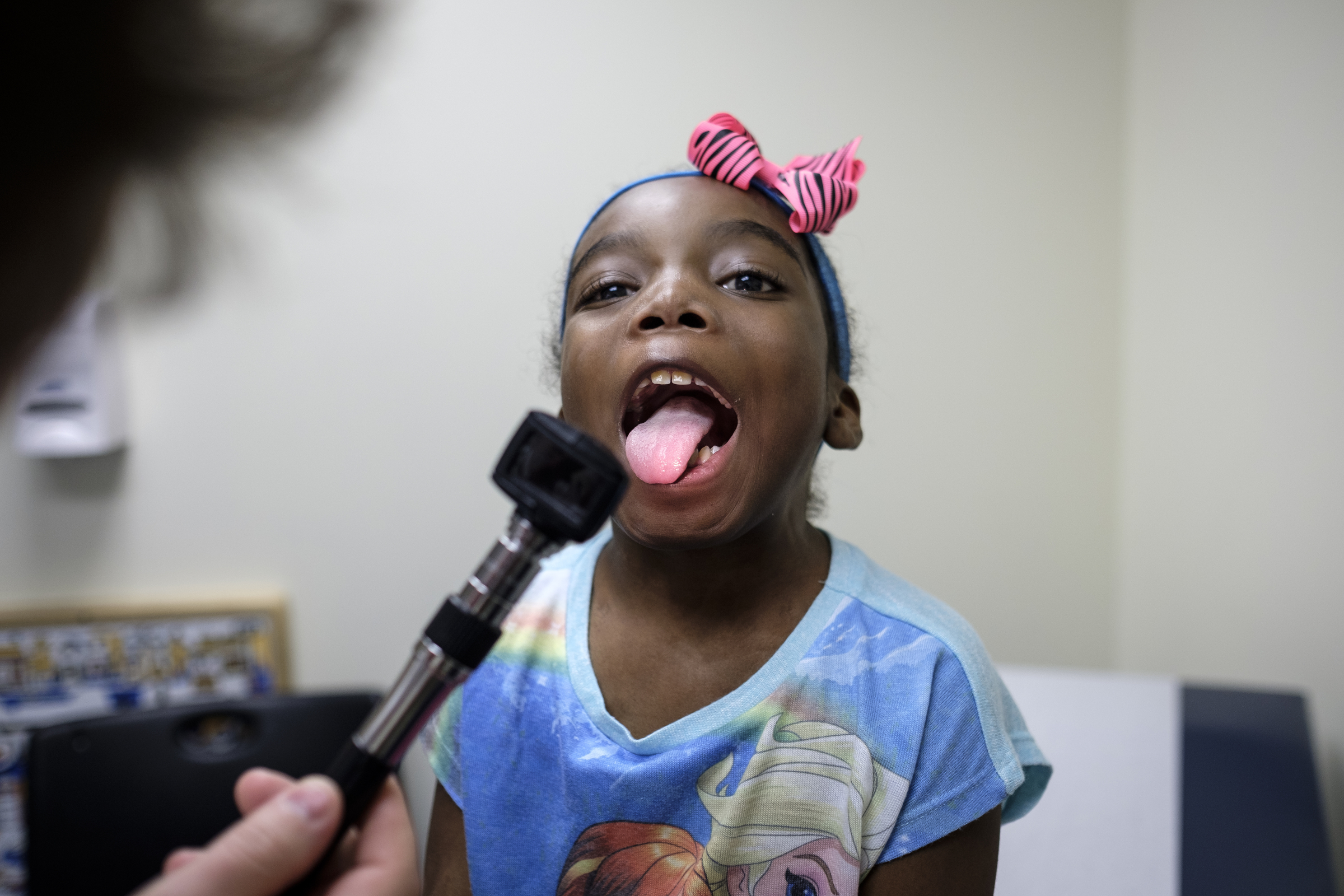 Ahmya Calloway opens her mouth as nurse practitioner Kari Wujcik performs an examination during one of Ahmya's regular checkups to monitor her new heart at Vanderbilt Children's Hospital on Thursday, June 30, 2016, in Nashville, Tenn. Almost two months after receiving a heart and kidney transplant, Ahmya was told she could transition to once-weekly checkups and return home to Chattanooga.
