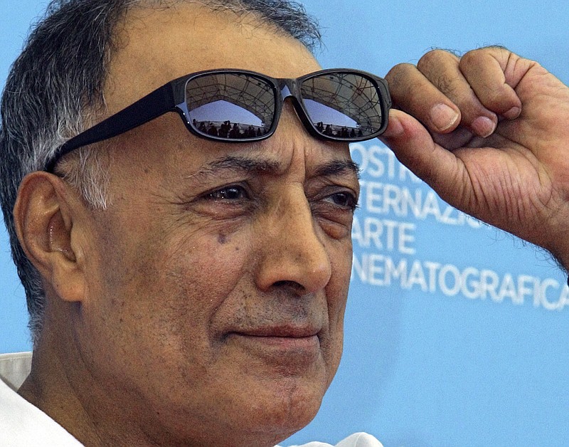 
              FILE - In an Aug. 28, 2008 file photo, acclaimed Iranian film director Abbas Kiarostami poses during the photo call of his movie 'Shirin' (My sweet Shirin) at the 65th edition of the Venice Film Festival in Venice, Italy.  Iran's official news agency IRNA says Kiarostami, whose 1997 film "Taste of Cherry" won the Palme d'Or,  died Monday, July 4, 2016, in Paris, where he had gone for cancer treatment. He was 76.  (AP Photo/Domenico Stinellis, File)
            
