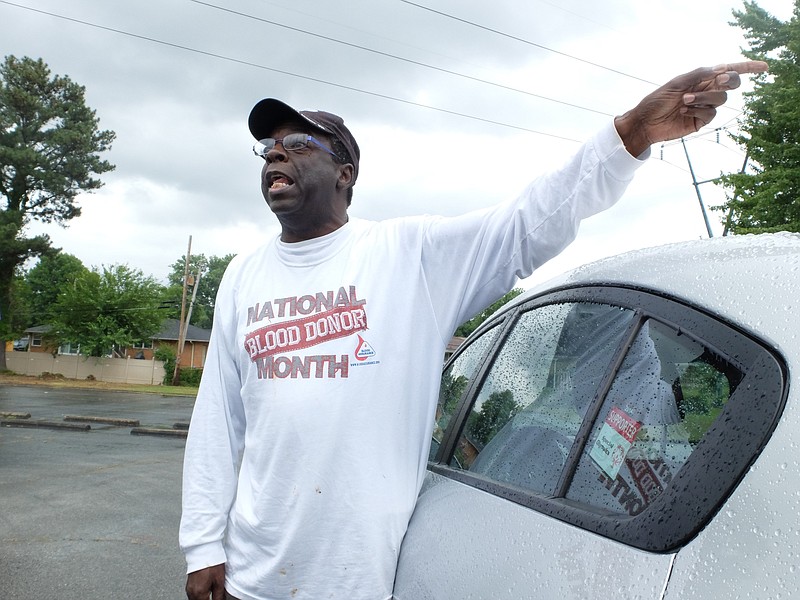 Just a block away from a "gathering house, " Ezra Harris, 56, president of the Woodmore Neighborhood Association, talks about the problems of recent violence in his community.